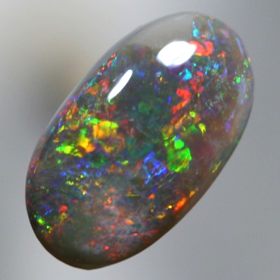 SOLID BLACK OPAL Bright sparkling fire red and copper orange